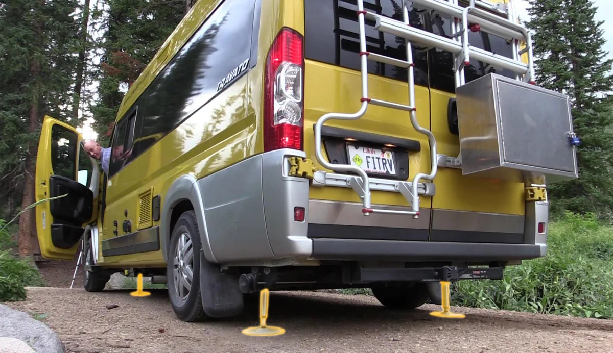 Hydraulic line replacement at a frame pass-through on a fifth wheel